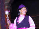tibetan woman with prayer wheel
